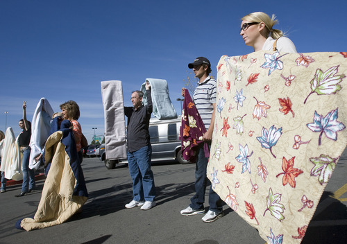 Al Hartmann  |  The Salt Lake Tribune
A flash mob of people with donated blankets 