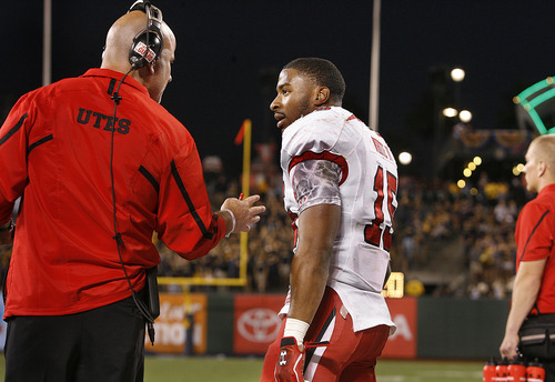 Scott Sommerdorf  |  The Salt Lake Tribune             
Running backs coach Dave Schramm talks to a frustrated RB John White IV during second half play. The Cal Bears beat Utah 34-10 at AT&T Park in San Francisco, Saturday, October 22, 2011.