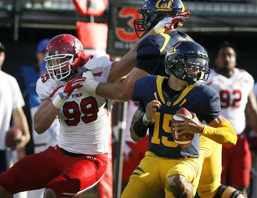 Scott Sommerdorf  |  The Salt Lake Tribune             
Cal QB Zach Maynard (15), spins away from the rush of Utah defensive end Joe Kruger (99) during first half play. The Cal Bears held a 20-0 halftime lead over Utah at AT&T Park in San Francisco, Saturday, October 22, 2011.