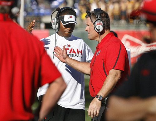 Scott Sommerdorf  |  The Salt Lake Tribune             
QB coach Brian Johnson slaps hands with head coach Kyle Whittingham just prior to kickoff against Cal. The Cal Bears held a 20-0 halftime lead over Utah at AT&T Park in San Francisco, Saturday, October 22, 2011.