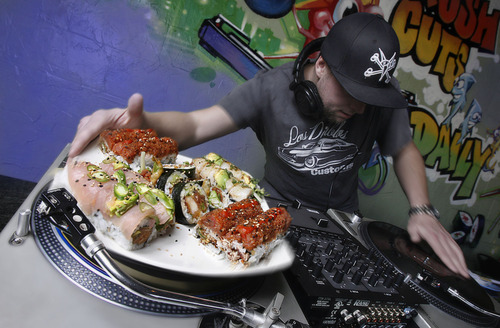Photo illustration by Francisco Kjolseth  |  The Salt Lake Tribune
DJ Justin Godina spins in the beat at Sushi Groove on Highland Drive on Friday nights. The background music at most restaurants is usually just that background -- coming from a Pandora playlist or cycling through the same five CDs. But a few local restaurants are bringing in DJ's who serve up music as the soundtrack to their food.