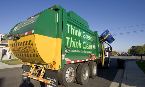 Al Hartmann  |  The Salt Lake Tribune

A Waste Management garbage truck that runs on compressed natural gas collects recycled materials in West Valley City. The truck cuts down on emissions and makes less noise.