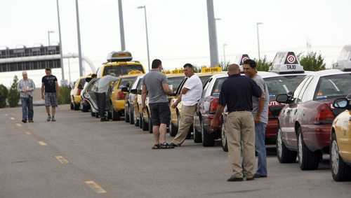 Francisco Kjolseth  |  The Salt Lake Tribune
The taxi dispatch line at the Salt Lake airport. (file photo)