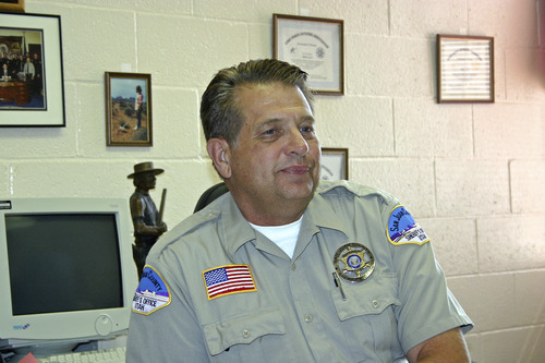 Tribune file photo
San Juan County Sheriff Mike Lacy discusses the discovery of bones he believes  to be those of Jason Wayne McVean, one of three Colorado fugitives who were the subject of an intense Four Corners manhunt in 1998.