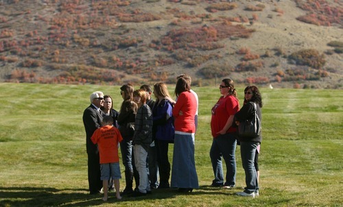 Leah Hogsten | The Salt Lake Tribune 
Alexis Rasmussen's family wait to talk with reporters Wednesday, Oct. 26, 2011, at Barker Park.