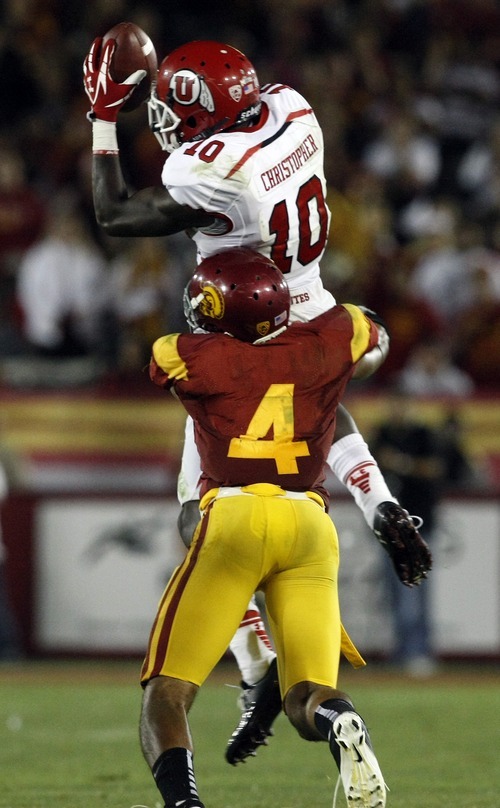 Chris Detrick  |  The Salt Lake Tribune
Utah Utes wide receiver DeVonte Christopher (10) makes a catch while being defended by USC Trojans cornerback Torin Harris (4) during the fourth quarter of the game at the Los Angeles Memorial Coliseum Saturday September 10, 2011. Christopher failed to make a first down.