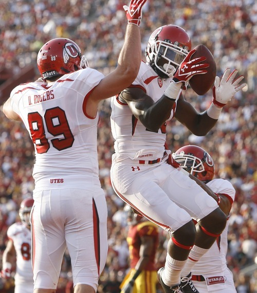 Chris Detrick  |  The Salt Lake Tribune
Utah Utes wide receiver DeVonte Christopher (10) celebrates with Utah Utes tight end Dallin Rogers (89) and Utah Utes wide receiver Reggie Dunn (14) after scoring a touchdown during the first half of the game at the Los Angeles Memorial Coliseum Saturday September 10, 2011.