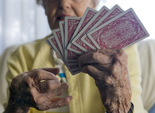 Al Hartmann  |  The Salt Lake Tribune
A 75-year old woman with osteo and rheumatoid arthritis.  She has lived with the condition for  35 years.  It limits her life in some ways but she still is able to play cards.