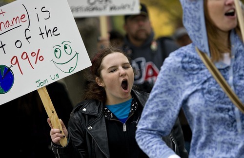 Djamila Grossman  |  The Salt Lake Tribune

Shelby Whittaker and others chant during a protest against the G20 Summit, at Pioneer Park in Salt Lake City on Saturday.
