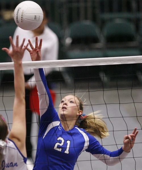 Trent Nelson  |  The Salt Lake Tribune
Richfield's Sammi Beck tips the ball over the net. Richfield vs. San Juan high school volleyball, 2A State Championship at Utah Valley University in Orem, UT on Saturday, October 29, 2011.