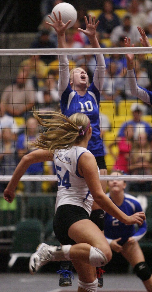 Trent Nelson  |  The Salt Lake Tribune
Richfield's Kately Eyre (10) attempts to block a spike by San Juan's Brooke Lyman. Richfield vs. San Juan high school volleyball, 2A State Championship at Utah Valley University in Orem, UT on Saturday, October 29, 2011.