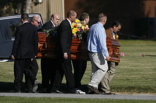 Rick Egan  | The Salt Lake Tribune 
 
Pallbearers carry the casket of 16-year-old Alexis Rasmussen, at the grave side service, at Valley View Memorial Park, in West Valley, Saturday, October 29, 2011.