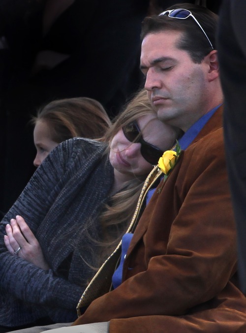 Rick Egan  | The Salt Lake Tribune 

Dawn and Mike Miera, mother and stepfather of 16-year-old Alexis Rasmussen, comfort each during the grave side service, at Valley View Memorial Park, in West Valley, Saturday, October 29, 2011.