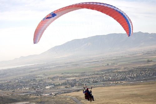 Djamila Grossman  |  The Salt Lake Tribune

United States military veterans paraglide at South Side Flight Park, Point of the Mountain in Draper, Utah, on Saturday, Oct. 29, 2011. The veterans paired up with pilots of the Utah Hang Gliding and Paragliding Association for tandem flights.
