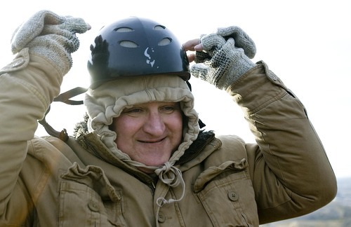 Djamila Grossman  |  The Salt Lake Tribune

Robert Davis, a retired Air Force combat pilot, puts on a helmet as he gets ready to paraglide at South Side Flight Park, Point of the Mountain in Draper, Utah, on Saturday, Oct. 29, 2011. Davis and other veterans paired up with pilots of the Utah Hang Gliding and Paragliding Association to fly.