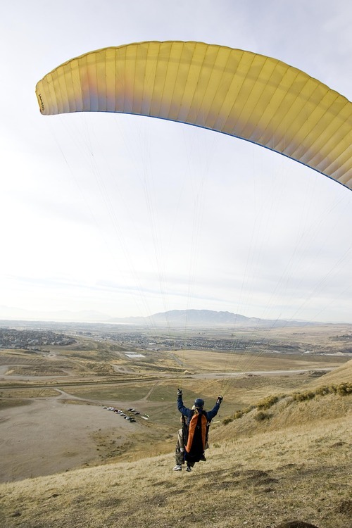 Djamila Grossman  |  The Salt Lake Tribune

United States military veterans paraglide at South Side Flight Park, Point of the Mountain in Draper, Utah, on Saturday, Oct. 29, 2011. The veterans paired up with pilots of the Utah Hang Gliding and Paragliding Association.