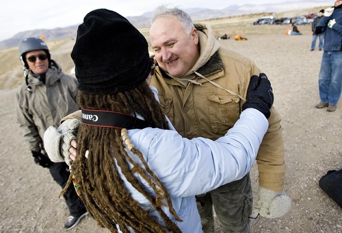Djamila Grossman  |  The Salt Lake Tribune

Robert Davis, a retired Air Force combat pilot, hugs Emily Potter, a Veterans Affairs recreation therapist, after he went paragliding at South Side Flight Park, Point of the Mountain in Draper, Utah, on Saturday, Oct. 29, 2011. Davis and other veterans paired up with a pilot of the Utah Hang Gliding and Paragliding Association to fly.