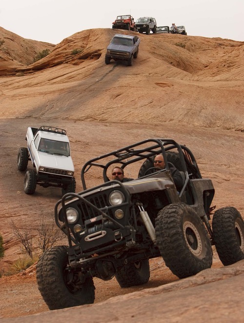 Recreation visitors -- including off-roaders like these on the Hell's Revenge 4x4 Trail last April -- provide 44 percent of Grand County's private-sector jobs, according to a report by Headwaters Economics.
Trent Nelson/The Salt Lake Tribune; 4.11.2009.