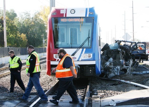 Steve Griffin  |  The Salt Lake Tribune


A derailed TRAX train sits near the intersection of 6100 south and 300 west in Murray, Utah after hitting a truck Monday, October 31, 2011.