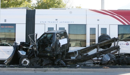 Steve Griffin  |  The Salt Lake Tribune


A derailed TRAX train sits near the intersection of 6100 south and 300 west in Murray, Utah after hitting this truck Monday, October 31, 2011.