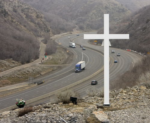 A cross along Interstate 80 about up Parleys Canyon memorializes Trooper Dan Harris, who died there in 1982 while chasing a speeder.   The cross is set above the roadway about 2 miles up the canyon.   Al Hartmann/The Salt Lake Tribune     3/9/09