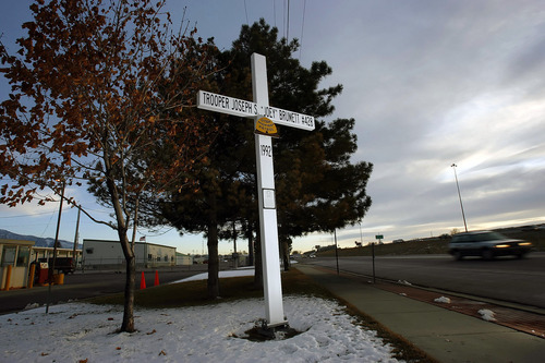 In this undated photo, a cross stands alongside Interstate 15 in Utah honoring fallen Utah Highway Patrol Trooper Joseph Brumett III. The Supreme Court won't hear an appeal of a ruling that 12-foot-high crosses along Utah highways in honor of dead state troopers violate the Constitution. (AP Photo/Salt Lake Tribune, Chris Detrick) DESERET NEWS OUT; LOCAL TV OUT