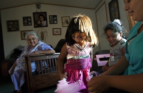 Djamila Grossman | The Salt Lake Tribune

Delila Bishop-Moon gets to dress up as a cheerleader for her birthday, as the family watches, at their home in Ibapah, Utah, on Friday, Sept. 9, 2011.