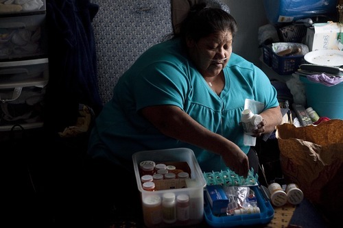 Djamila Grossman | The Salt Lake Tribune

Delia Moon sorts through her medicine at her family's home in Ibapah, Utah, on Thursday, Oct. 6, 2011.