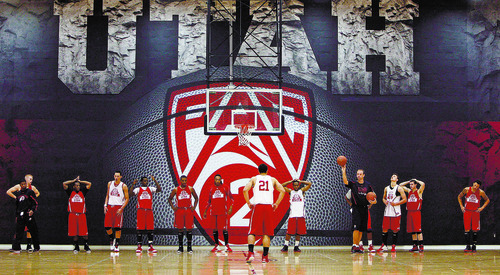 Francisco Kjolseth  |  The Salt Lake Tribune
The University of Utah basketball team starts their second full week of practice under first year coach Larry Krystkowiak, at right with ball, in the renovated Hyper gym on the University of Utah campus on Tuesday, October 25, 2011.
