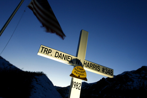 Chris Detrick | Tribune file photo   
A cross overlooks I-80 in memorial of Trooper Daniel W. Harris.