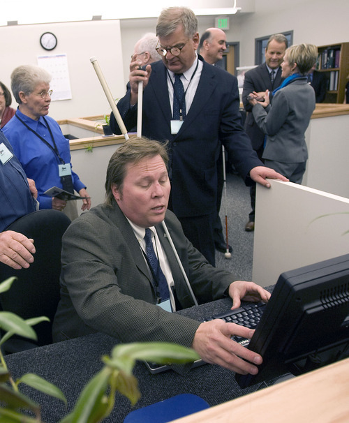 Al Hartmann  |  The Salt Lake Tribune 
Everete Bacon, chairman for the Library Council and Division of the Blind, checks out a computer editing station at the new Utah State Library Reading for the Blind facility at Utah State Prison on Tuesday, Nov. 1.
