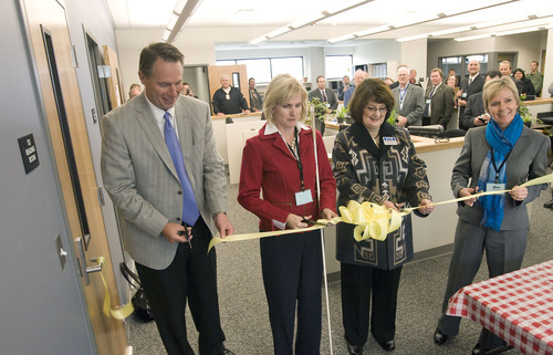 Al Hartmann  |  The Salt Lake Tribune 
Tom Patterson, executive director of Utah Department of Corrections, left, Kristen Cox, executive director for Utah Department of Workforce Services, Donna Jones Morris, Utah State Librarian, and Julie Fischer, with the Utah Department of Community and Culture, cut a ribbon to open the Utah State Library Reading for the Blind facility at Utah State Prison on Tuesday, Nov. 1.