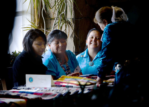 Steve Griffin  |  The Salt Lake Tribune

Rug weavers Raquel Benale, Ella Benally, Autumn Yazzie and Elsie Benale, of Forest Lake, AZ, look over their rugs during the 21st Annual Navajo Rug Show and Sale in the Snow Park Lodge at Deer Valley  in Park City Friday, November 12, 2010. The event is sponsored by the Adopt-A-Native-Elder ad Navajo weavers. The event runs through Sunday Nov. 14, 2010 and more information is available at www.anelder.org.