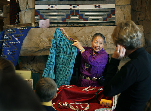 Scott Sommerdorf  |  Salt Lake Tribune
NAVAJO RUG SALE & SHOW
Marie Bahe (from Teesto near Winslow, AZ) shows a skirt to a potential customer at the 20th annual Navajo rug sale/show at Snow Park Lodge in Deer Valley.