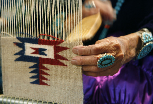 Scott Sommerdorf  |  Salt Lake Tribune
NAVAJO RUG SALE & SHOW
The experienced hands of Anna Jackson (Teesto)  do the precise weaving on a small Navajo rug at a weaving demonstration at the 20th annual Navajo rug sale/show at Snow Park Lodge in Deer Valley.