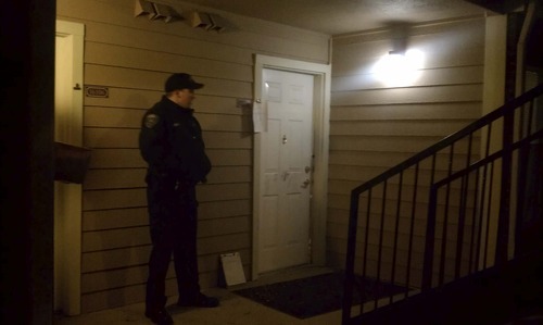 Cimaron Neugebauer  |  The Salt Lake Tribune
Unified Police Department officers guard the door of an apartment
where two bodies were found Friday. A man and a woman were found dead
in a unit at the Remington Apartments in Midvale on Friday Nov. 4.