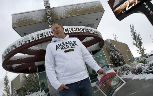 Francisco Kjolseth  |  The Salt Lake Tribune
Weston Kubbe, 32, of Murray is happy to have an extra $125 in his pocket, courtesy of a Bank Transfer Day promotion by Mountain America Credit Union. Kubbe saw a newspaper advertisement about the 