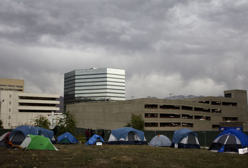 Kim Raff |  The Salt Lake Tribune

Occupy SLC activists set up an additional tent occupation Friday on an abandoned lot at 147 S. State St. in downtown Salt Lake City.