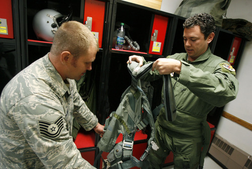 Francisco Kjolseth  |  The Salt Lake Tribune
Tech Sgt. Ben Talbot helps Congressman Jason Chaffetz get into his flight suit on Saturday for an up-close look at how the F-16 aircraft at Hill Air Force base and its reservists support joint combat operations to protect soldiers on the ground in deployed regions.