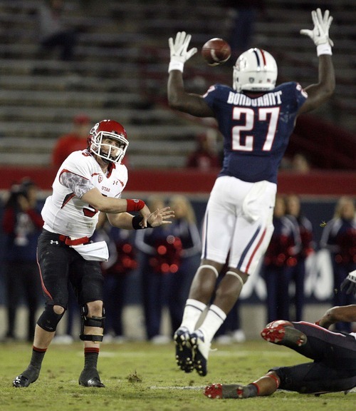 Trent Nelson  |  The Salt Lake Tribune
Utah's Jon Hays passes over Arizona's Tra'Mayne Bondurant during the second half as Utah faces Arizona, college football at Arizona Stadium in Tucson, Arizona, Saturday, November 5, 2011.