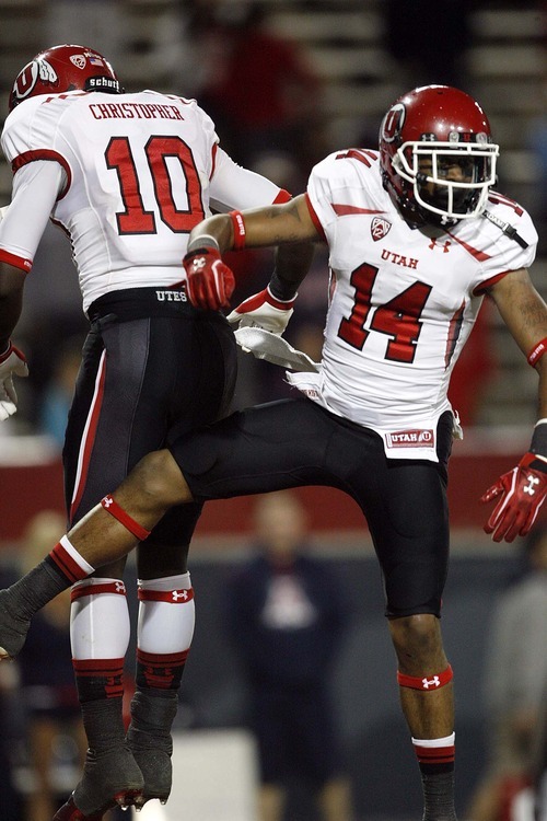 Trent Nelson  |  The Salt Lake Tribune
Utah's Reggie Dunn (14) celebrates a touchdown with teammate DeVonte Christopher during the second half as Utah faces Arizona, college football at Arizona Stadium in Tucson, Arizona, Saturday, November 5, 2011.