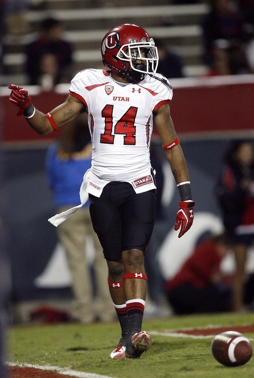 Trent Nelson  |  The Salt Lake Tribune
Utah's Reggie Dunn celebrates a touchdown during the second half as Utah faces Arizona, college football at Arizona Stadium in Tucson, Arizona, Saturday, November 5, 2011.