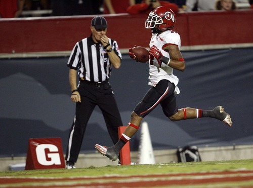 Trent Nelson  |  The Salt Lake Tribune
Utah's Reggie Dunn pulls in a pass and runs for a touchdown during the second half as Utah faces Arizona, college football at Arizona Stadium in Tucson, Arizona, Saturday, November 5, 2011.