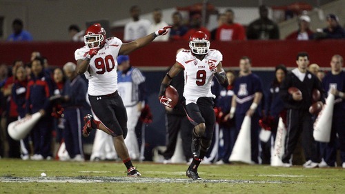 Trent Nelson  |  The Salt Lake Tribune
Utah's Conroy Black runs back an interception during the second half as Utah faces Arizona, college football at Arizona Stadium in Tucson, Arizona, Saturday, November 5, 2011. Utah's Derrick Shelby at left.