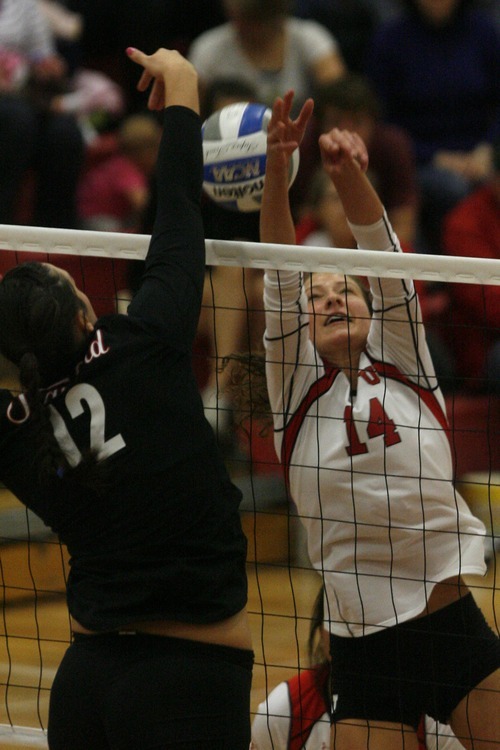 Chris Detrick  |  The Salt Lake Tribune
Stanford's Stephanie Browne (12) spikes the ball past Utah's Abby Simmons (14) during the game at the Crimson Court Saturday November 5, 2011.  Stanford won the match 3-0.