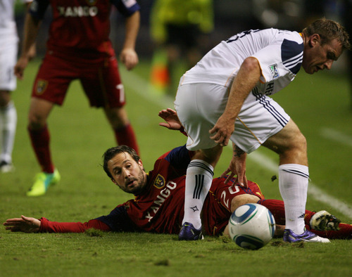 Kim Raff |  The Salt Lake Tribune
Real Salt Lake player (left) Ned Grabavoy taps the ball around the feet of LA Galaxy player Chris Birchall during the second half of the Western Conference Championship at The Home Depot Center in Carson, CA on Sunday, November 6, 2011.