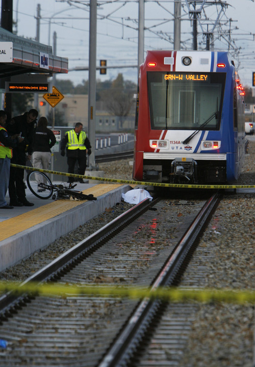 Francisco Kjolseth  |  The Salt Lake Tribune
A bicyclist was killed after being dragged under by a West bound TRAX train at the Redwood Junction station at 1740 West, Research Way near 2770 South and Redwood on Monday morning, November, 7, 2011,  with the first 911 call being made at 6:47 a.m. The crash involved the Green Line train, running from downtown Salt Lake City to West Valley City.