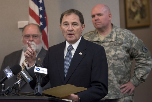 Al Hartmann  |  The Salt Lake Tribune
Utah Governor Gary Herbert  announced an initiative on Wednesday Novmeber 9 to allow Utah military veterans and Utah National Guard members to match their Military Occupational Specialty code which designates specific jobs in the military to civilian occupations.   That will help them count their service work and training toward a specialized license or educational requirement in the job market.   Terry Schow, Executive Director of Utah Department of Veterans Affairs, left, and Colonel Scott Olson of the Utah National Guard, right, listen in.