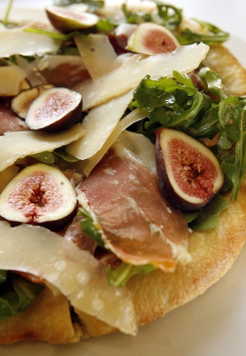 Tribune file photo
The Olive barrel pizza at Sea Salt includes arugula, prosciutto and black mission figs.