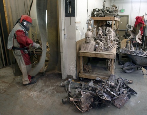 Steve Griffin  |  The Salt Lake Tribune

A worker heads into the sandblasting room at Adonis Bronze.
